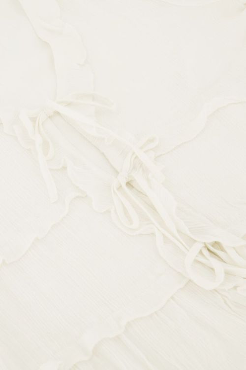 Witte top met ruffles en koordjes