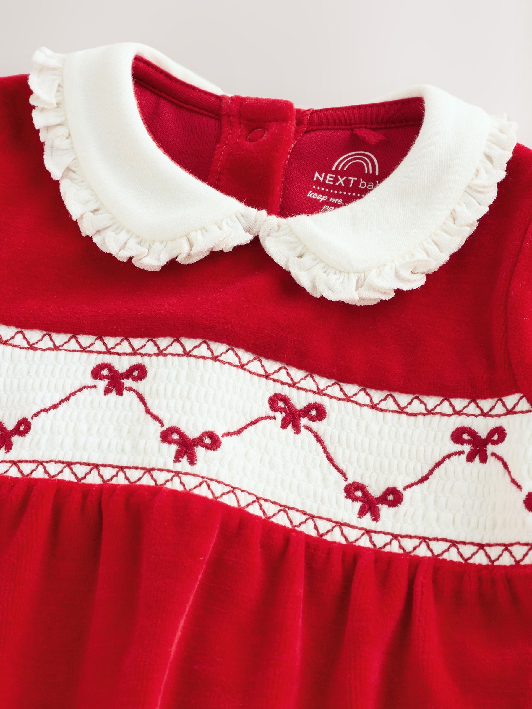 Rode strik - Velours babypyjama (0mnd-2jr)