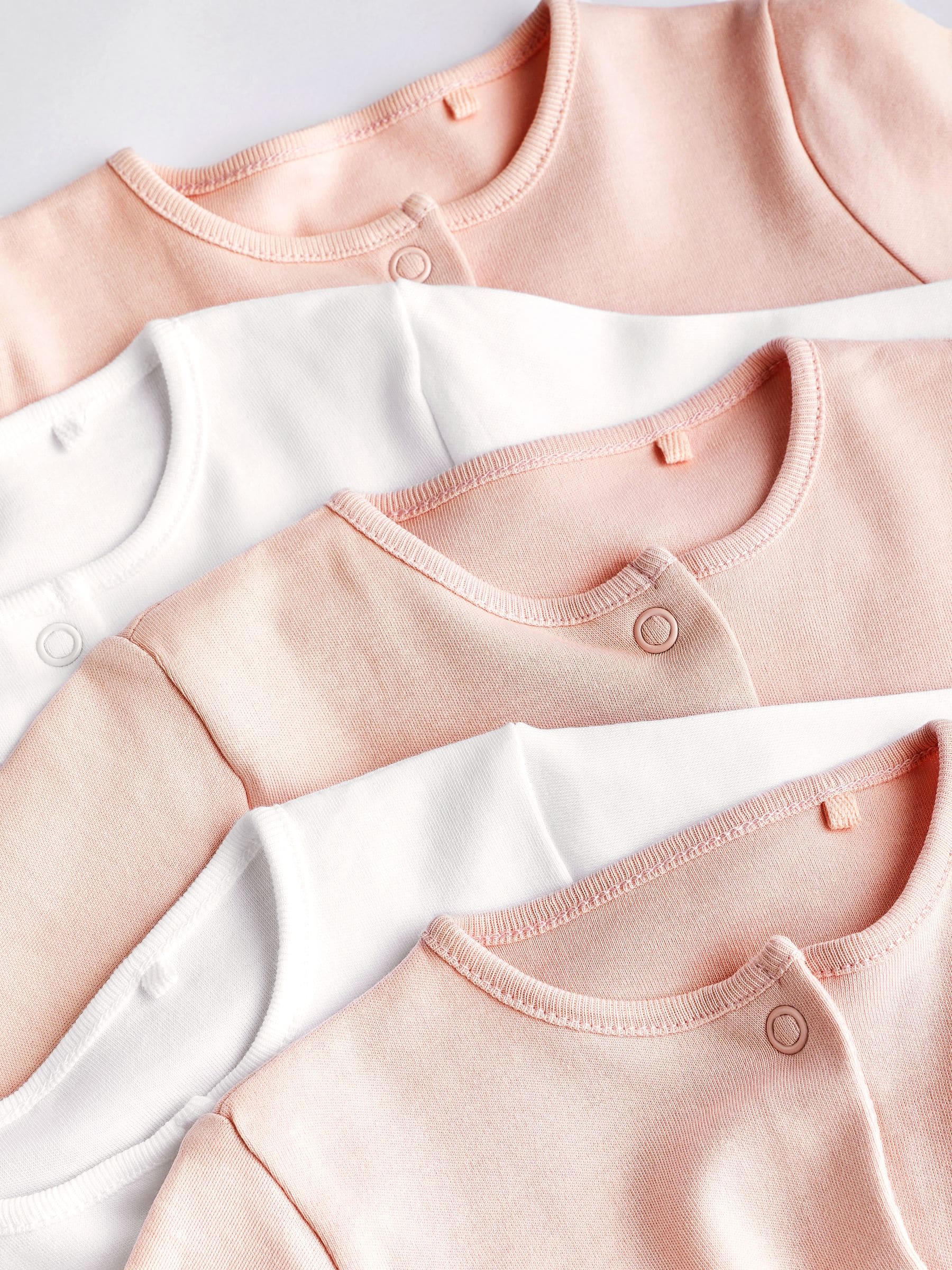 Roze/wit - Babypyjama's (0-2 jr)