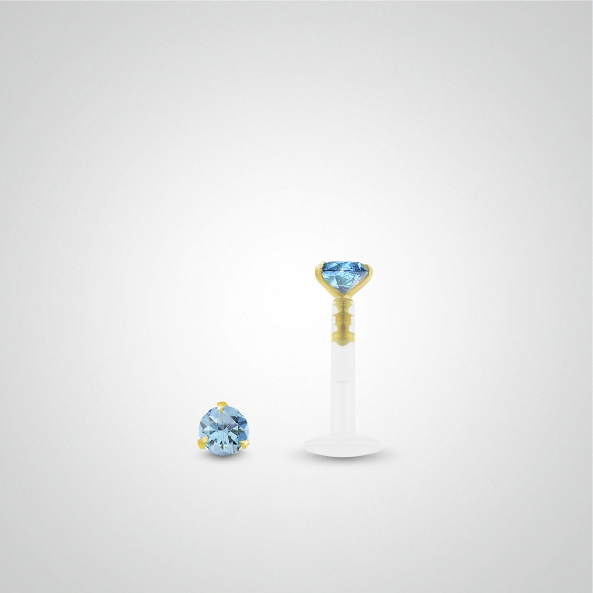 Piercing tragus : or jaune avec oxyde de zirconium bleu clair