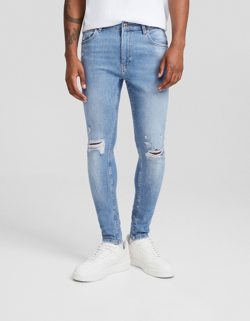 Calça jeans skinny rasgada