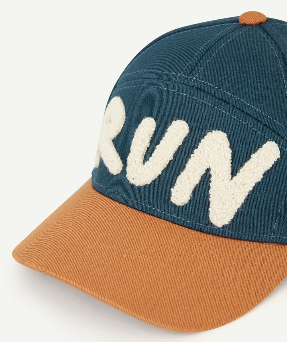 LASSIGCASQUETTE BLEU MARINE AVEC MESSAGE RUN EN BOUCLETTE