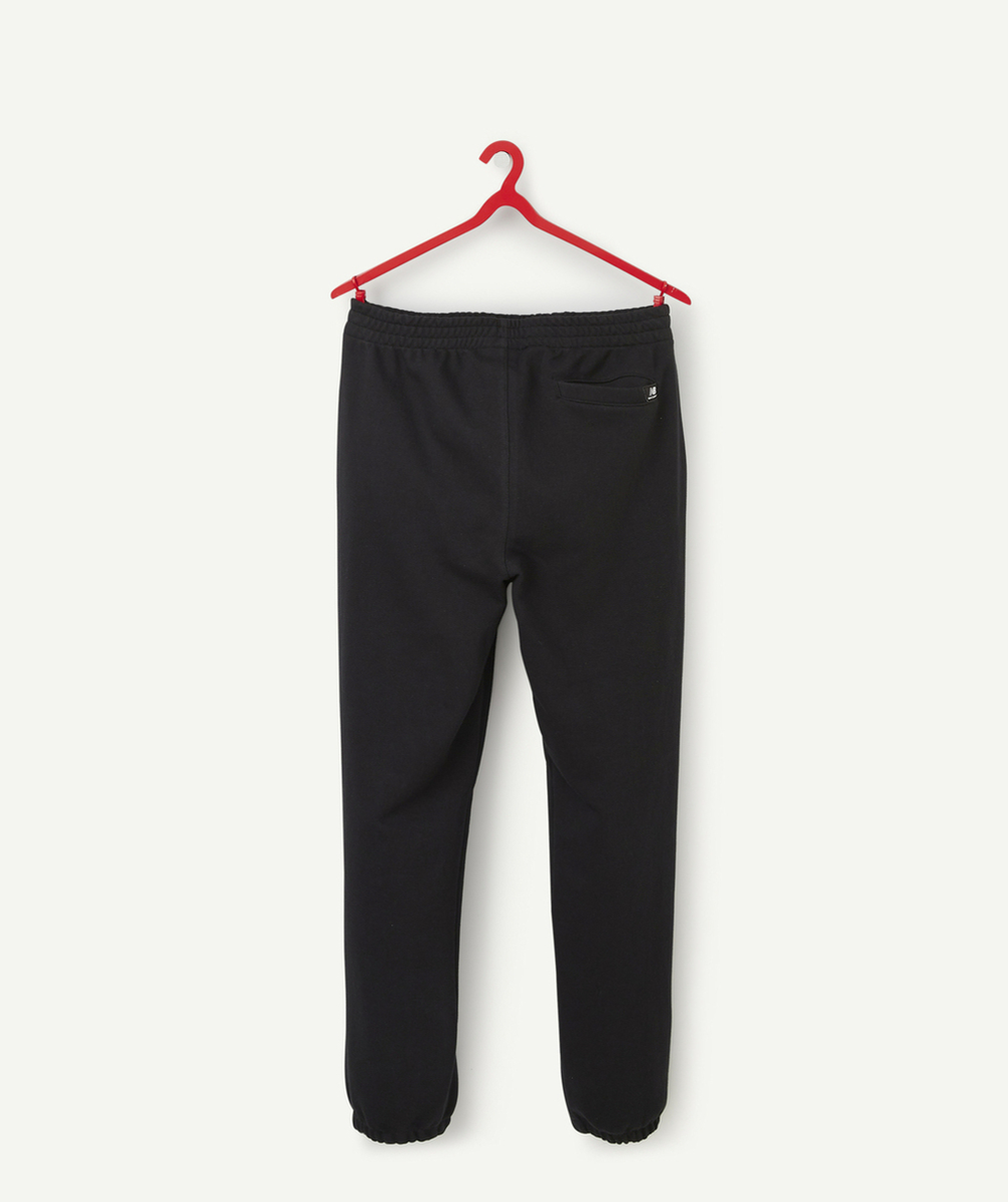 NEW BALANCEJOGGING NOIR GARÇON ESSENTIALS STACKED LOGO