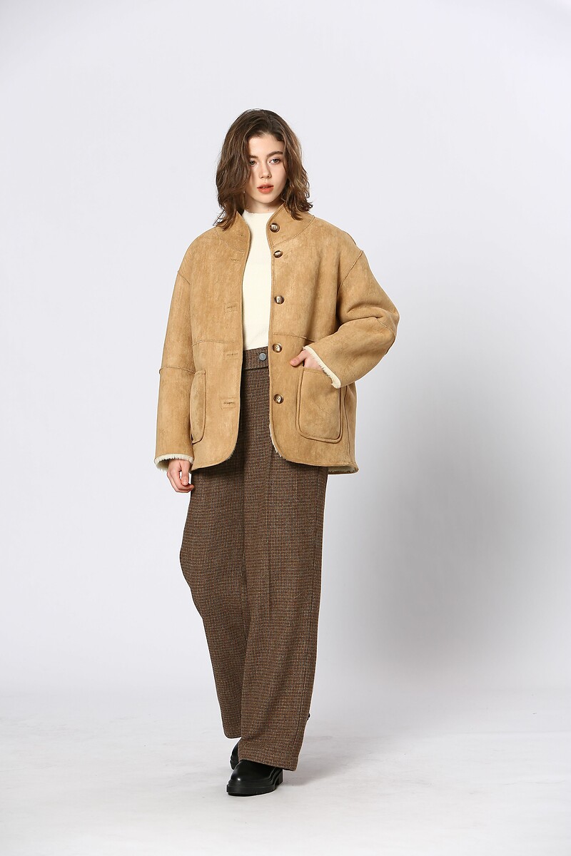 Vejo você em breve<br>Omkeerbare jas em sherpa