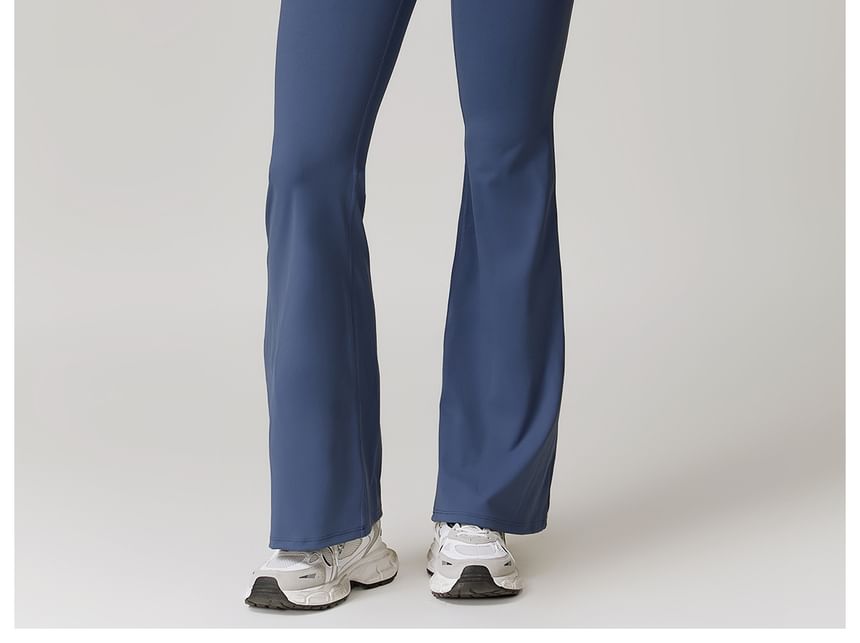 Skinniano - Mouwloze ronde hals, effen open rug, uitlopende sportjumpsuit