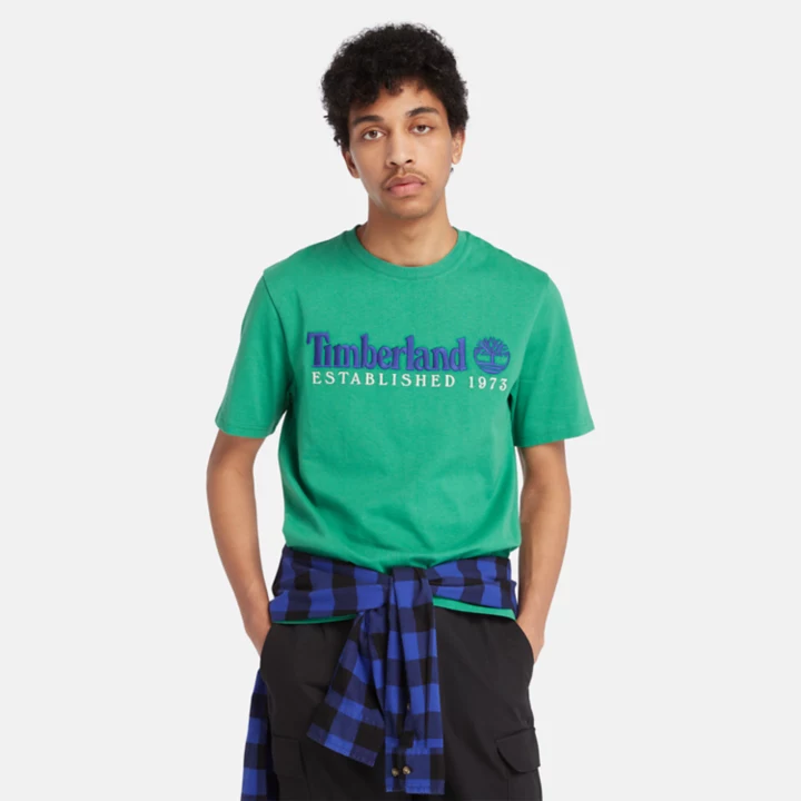 Camiseta masculina verde da equipe Est. 1973.