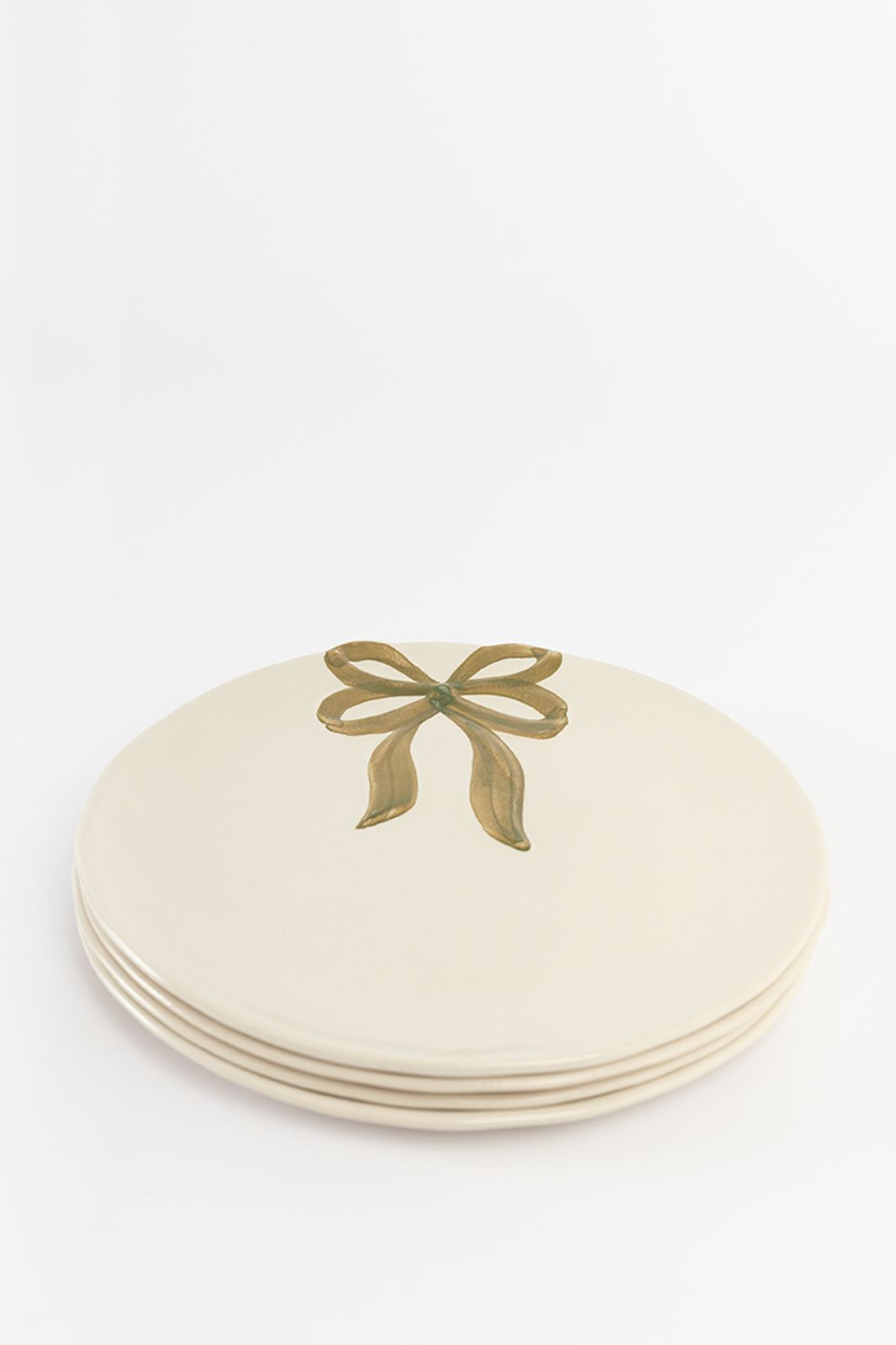 Beige ontbijtbord met gouden strik