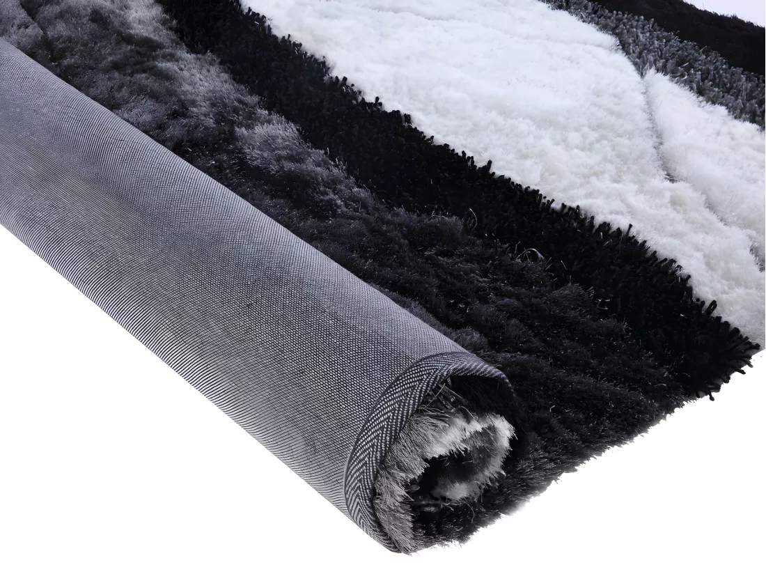 Tapis shaggy à poils longs ECUME - tufté main - Noir et Blanc - 140 x 200 cm