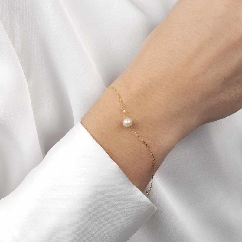 Bracelet Or jaune 375/1000 et perles