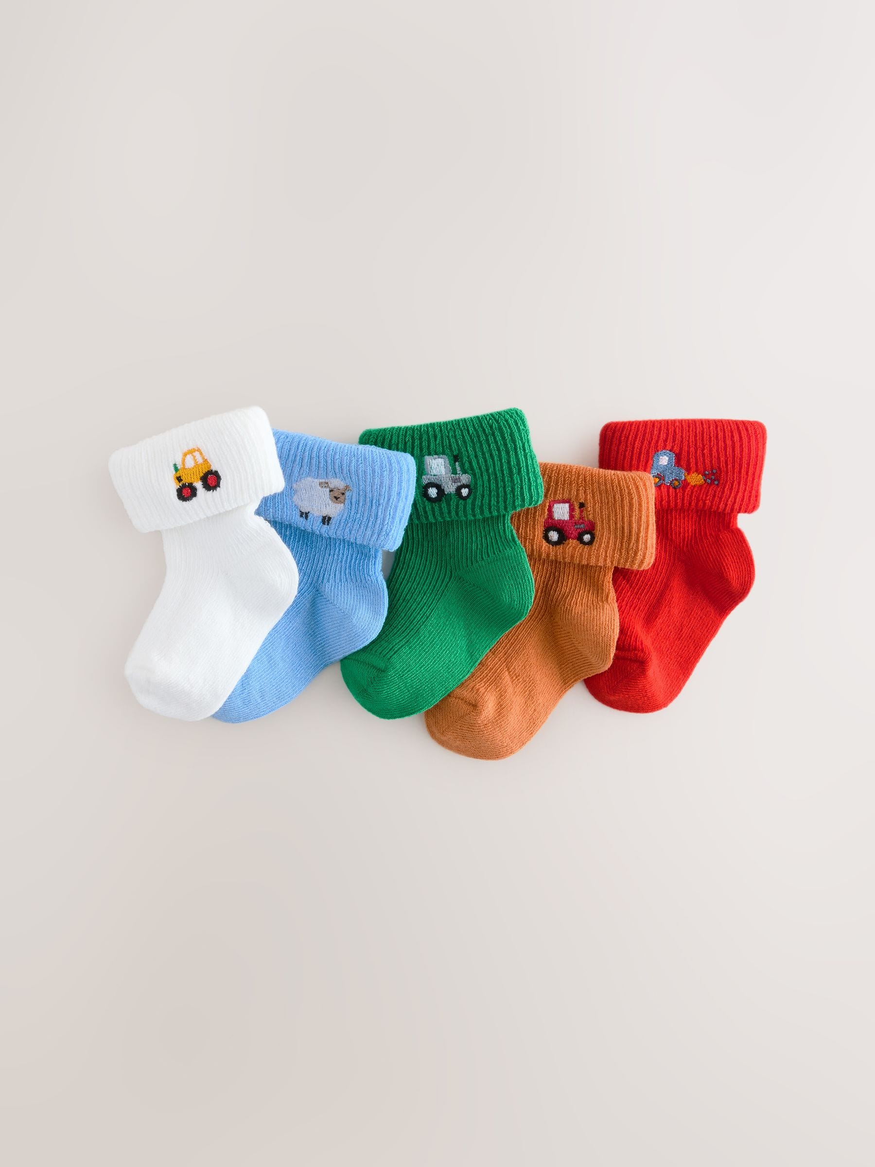 Felgekleurd met figuurtjes - Set van 5 geborduurde sokken met omslag (0mnd-2jr)