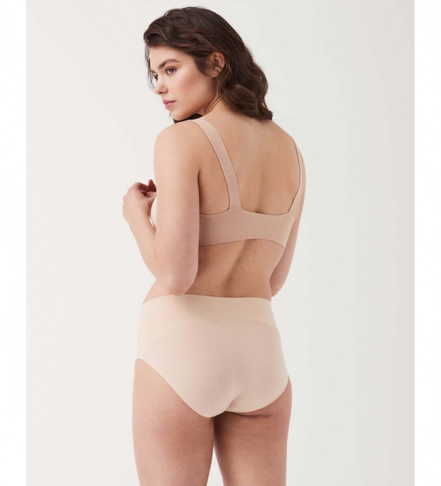 Calcinha modeladora sem costura de cintura alta SPANX na cor nude.