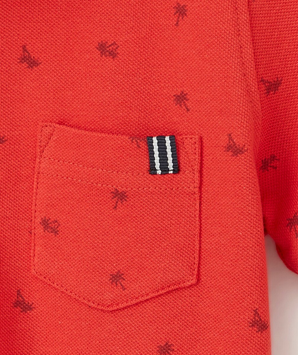 LE POLO ROUGE DOUBLE COL AVEC ANIMATION PALMIERS
