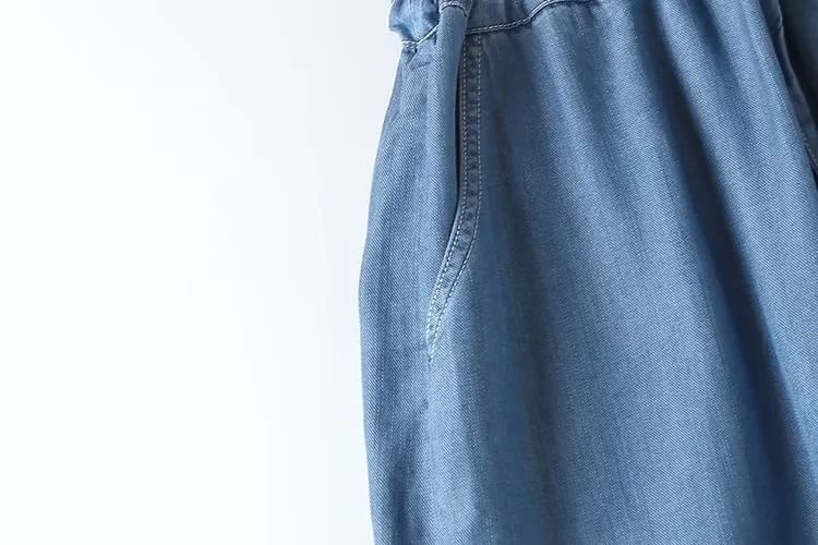 Aigan - Denim jumpsuit met korte mouwen, knoopsluiting en trekkoord
