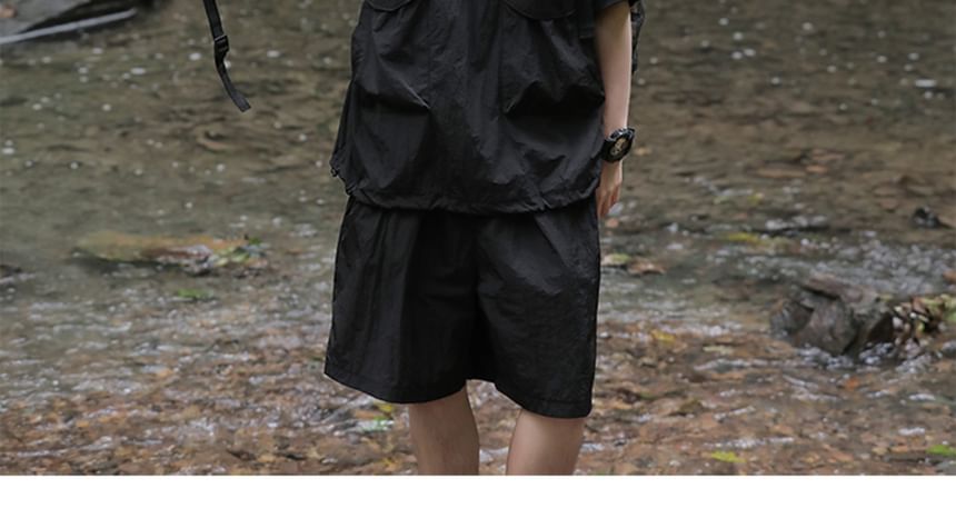 Trimecca - Set: Top met elleboogmouwen, opstaande kraag en halve rits + shorts