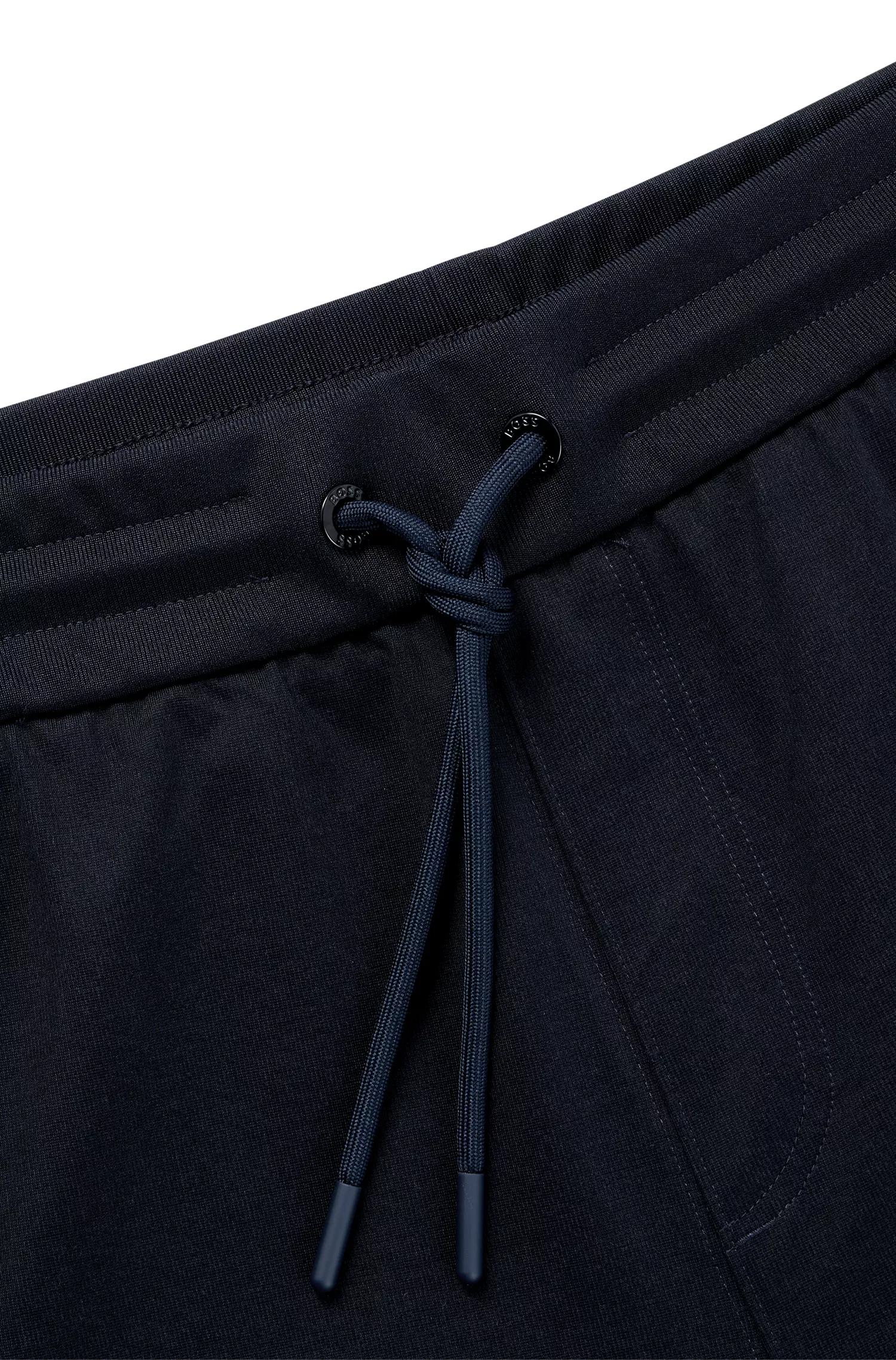 Calça de fato de treino BOSS preta, corte regular, com detalhes contrastantes.