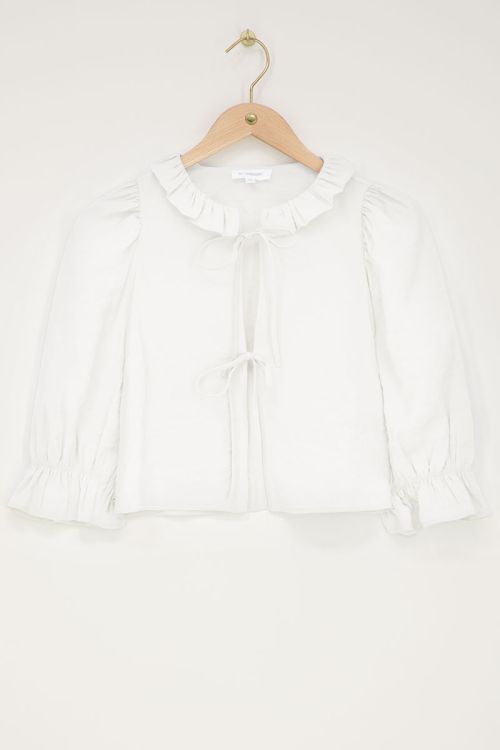 Witte top met strikjes en ruffle kraag