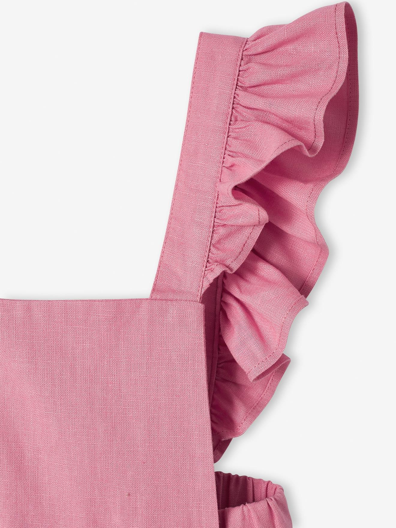 Jardineira infantil rosa em linho e algodão com babado.