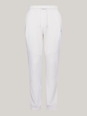 Calça de moletom esportiva essencial com logo tonal e punhos canelados