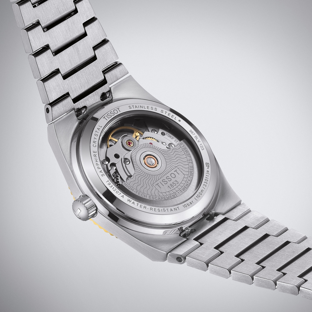 Tissot PRX 35 Powermatic 80 Silbrig / 18 Karat Gelbgold
