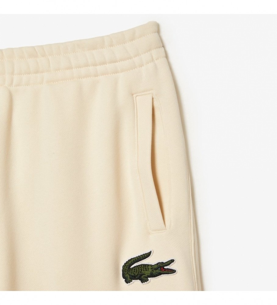 Calça de treino Lacoste unissex em fleece bege.