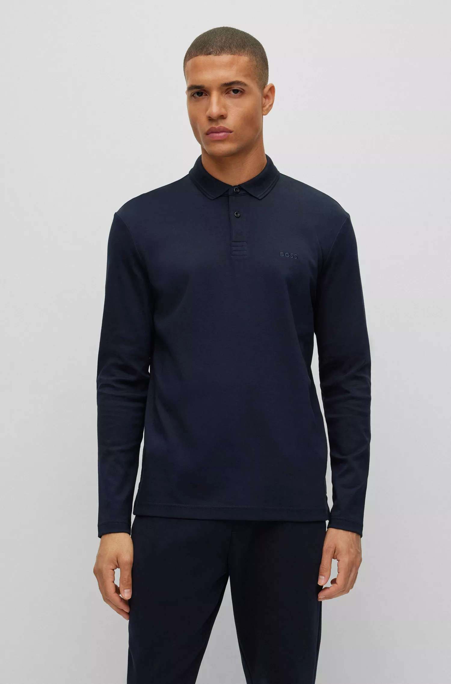 Camisa polo BOSS verde em algodão interlock com logotipo tonal.