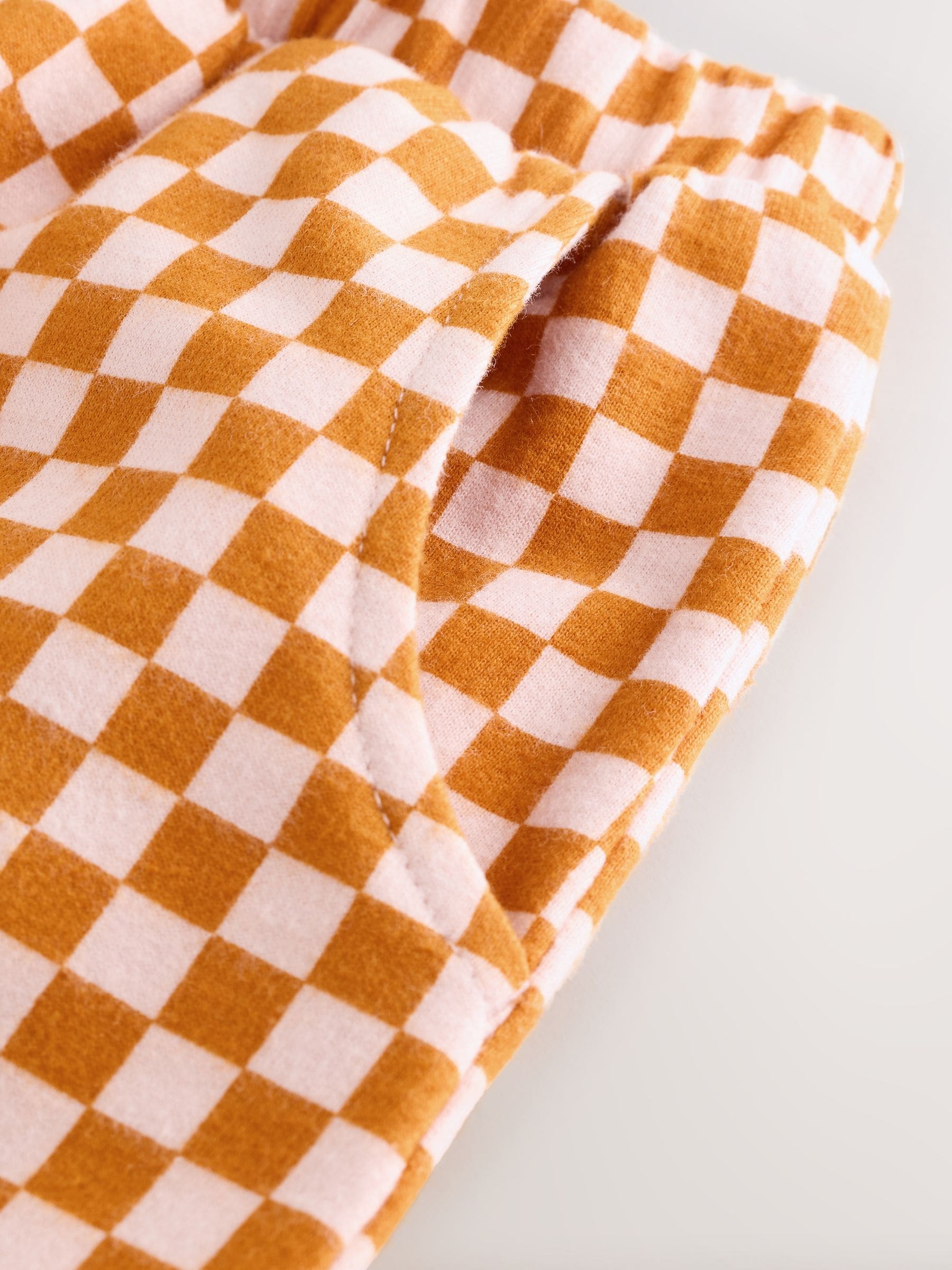Oranje met dambordmotief - Broek met wijde kortere pijpen (3mnd -7jr)