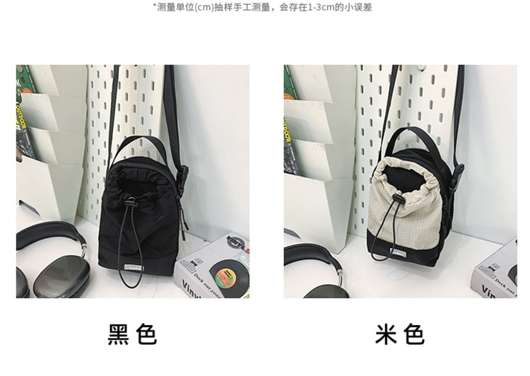 IOU - Nylon crossbodytas met trekkoordapplicatie