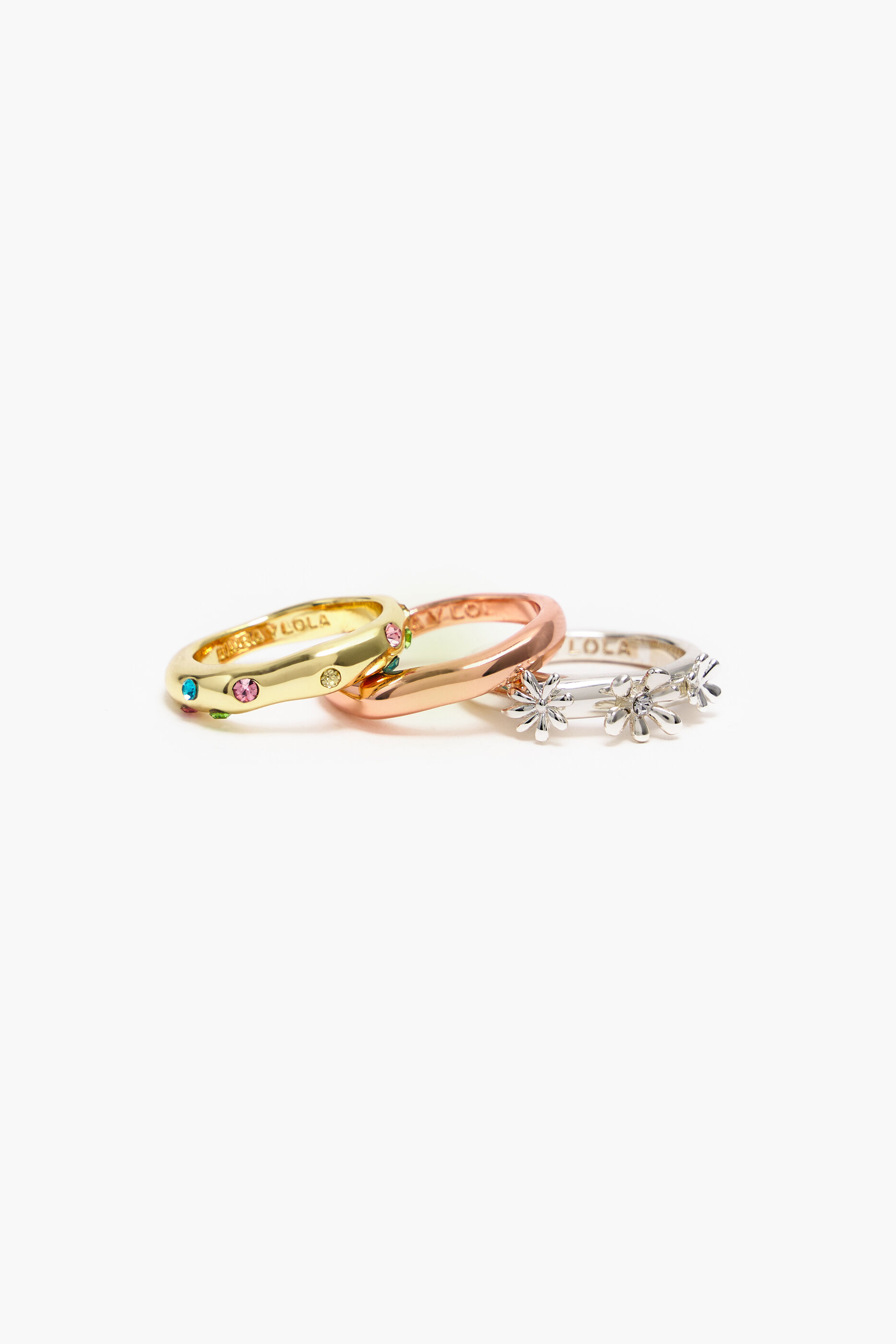 Conjunto de anéis, flores e cristais