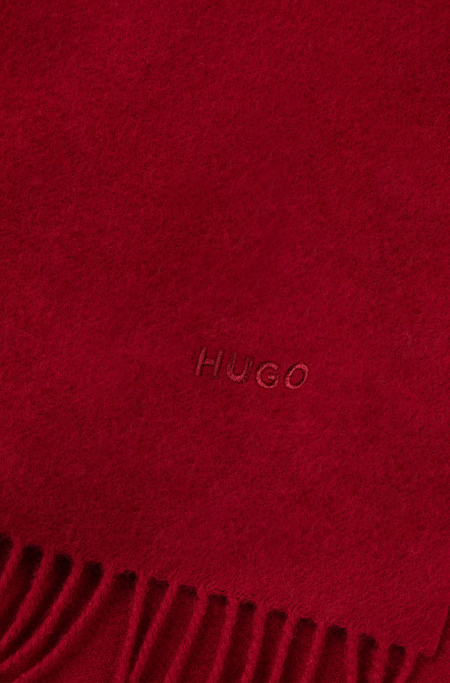 Cachecol HUGO de lã com franjas vermelhas e logotipo bordado.
