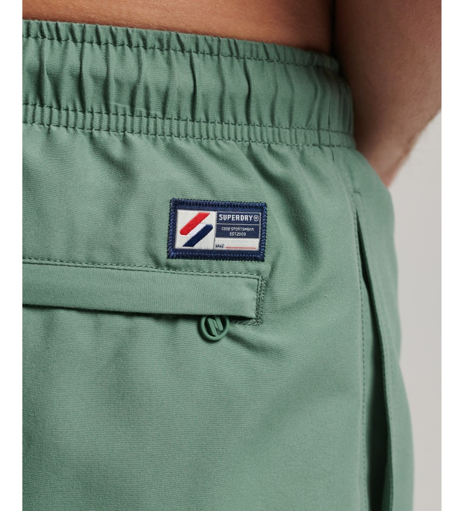 Maiô Superdry tamanho 48cm com apliques, confeccionado em material reciclado ecológico.