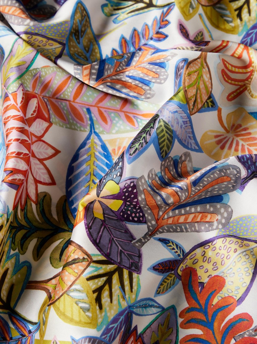 Blusa estilo poncho com padrão tropical