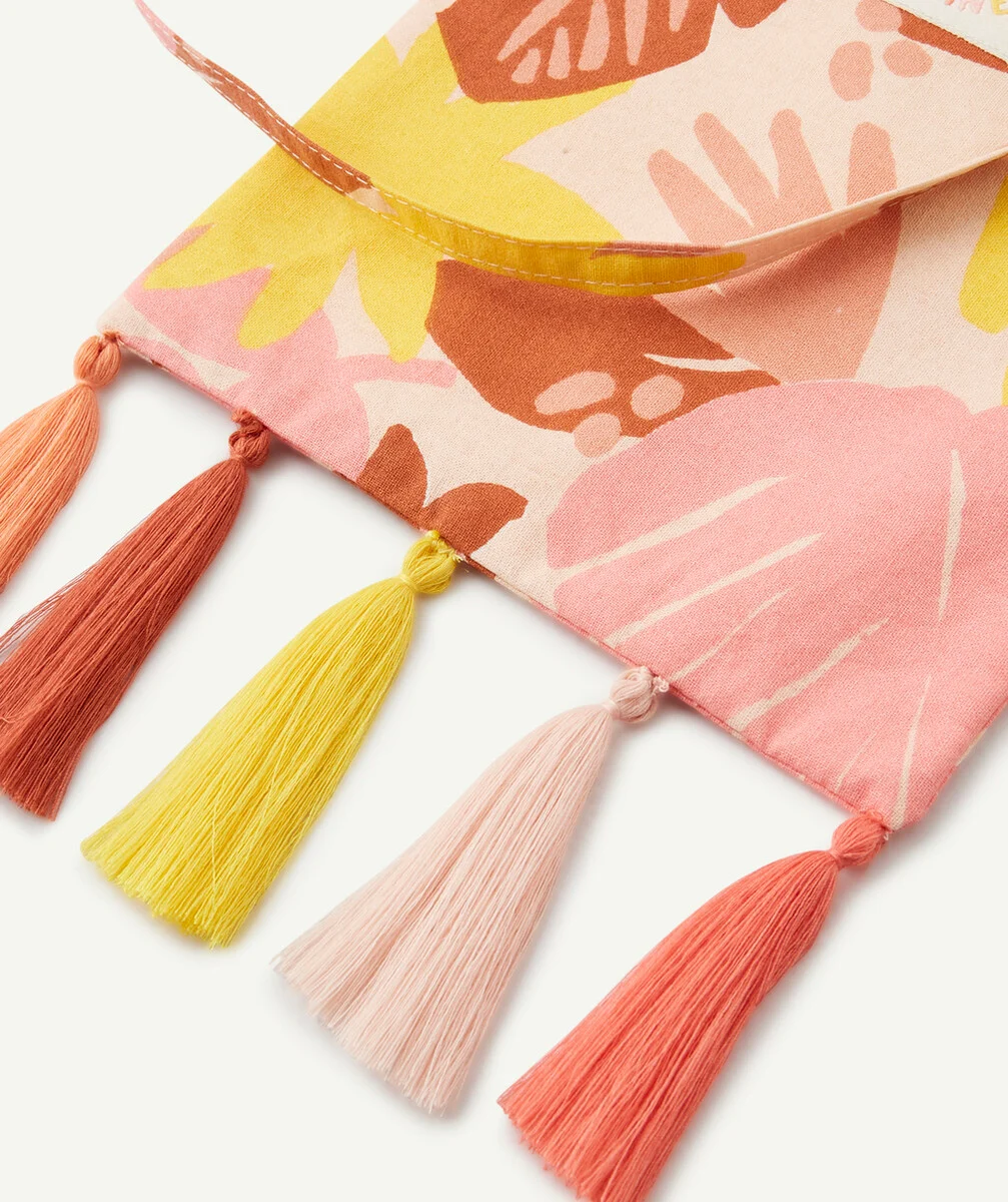 LE SAC EN TISSU IMPRIMÉ TROPICAL AVEC POMPONS