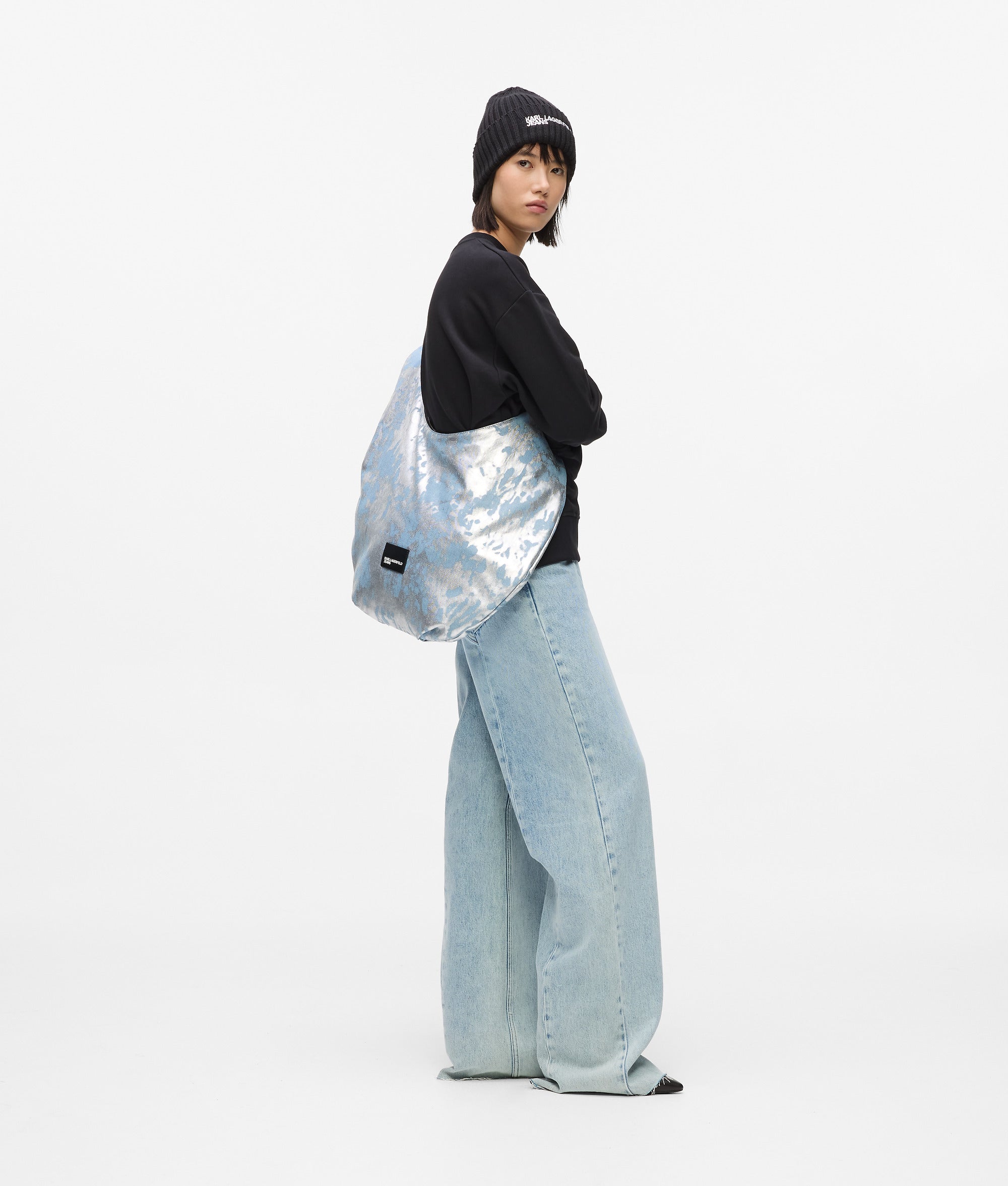 Grote hoogglans denim schoudertas