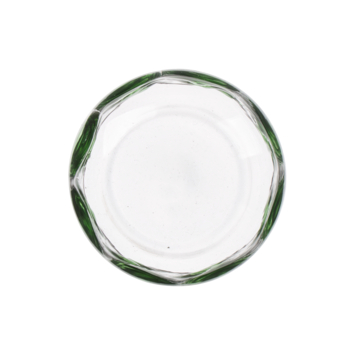 Glas met groene stippen