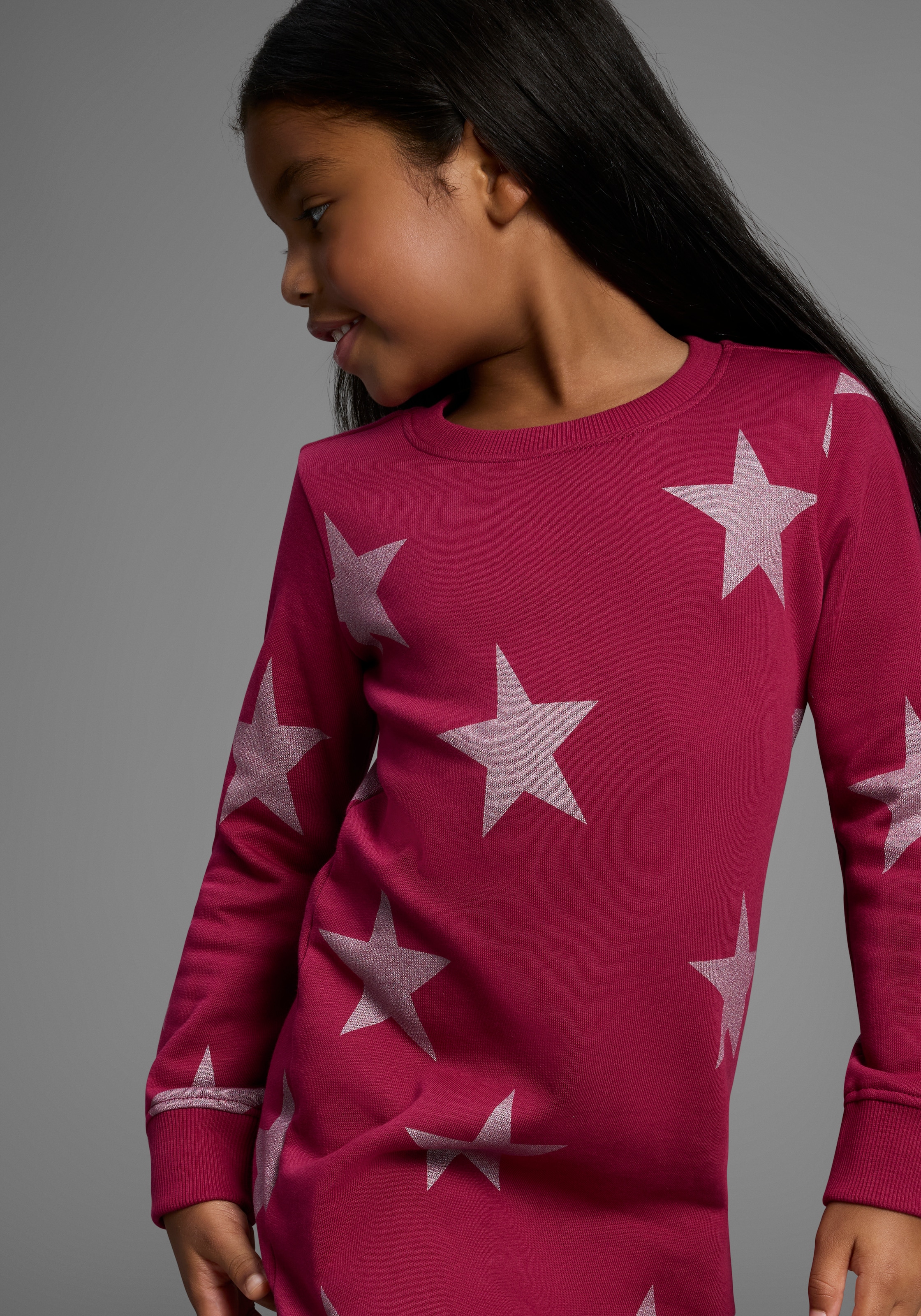 KIDSWORLD Sweatkleid »Sterne-Allover Kleid für kleine Mädchen« Sweatkleid mit Glitzerdruck