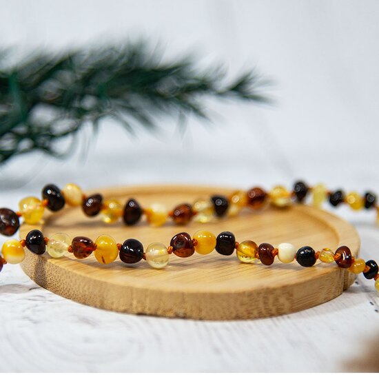 Collier Ambre bébé   Multi        de               Irréversible