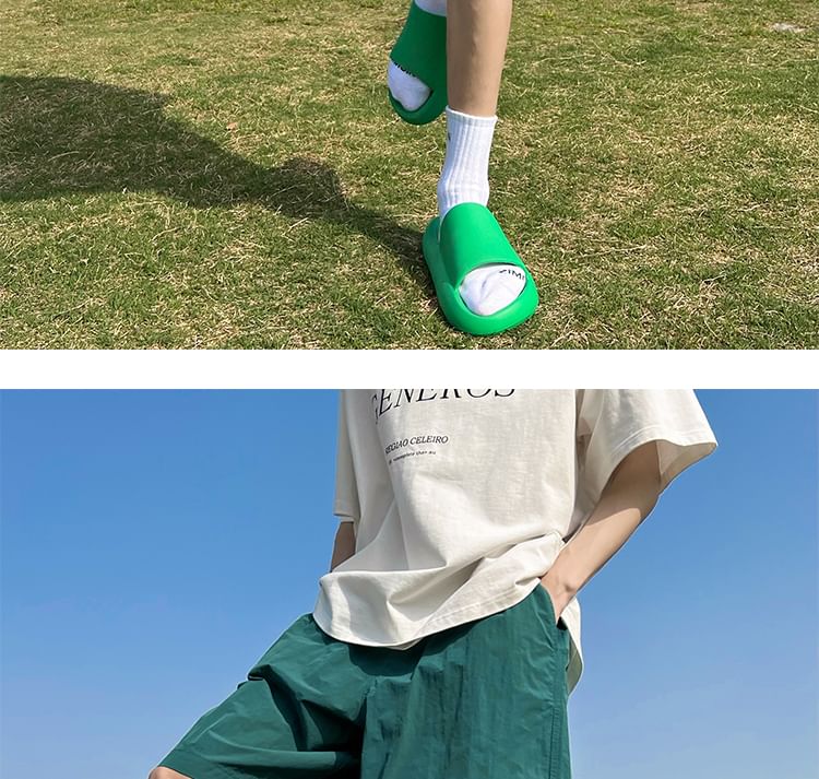 AXEN - Wijde shorts met geborduurde letters en middelhoge taille