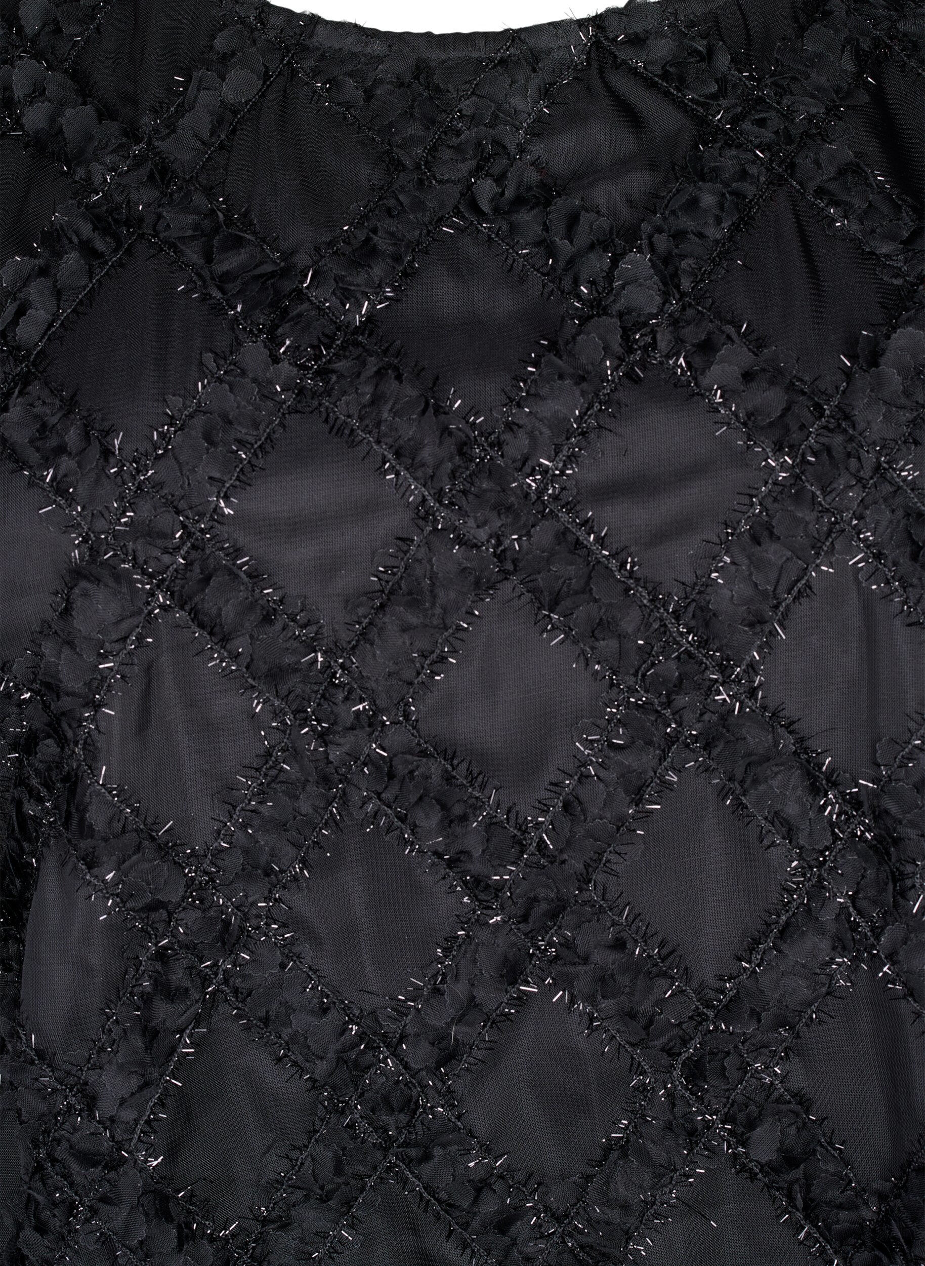 Bluse med harlequin mønster