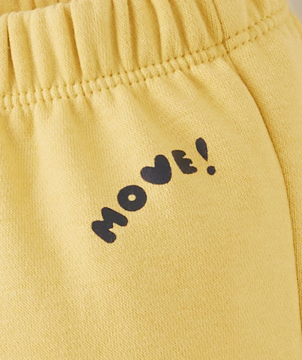 JOGGING BÉBÉ GARÇON EN FIBRES RECYCLÉES JAUNE AVEC MESSAGE