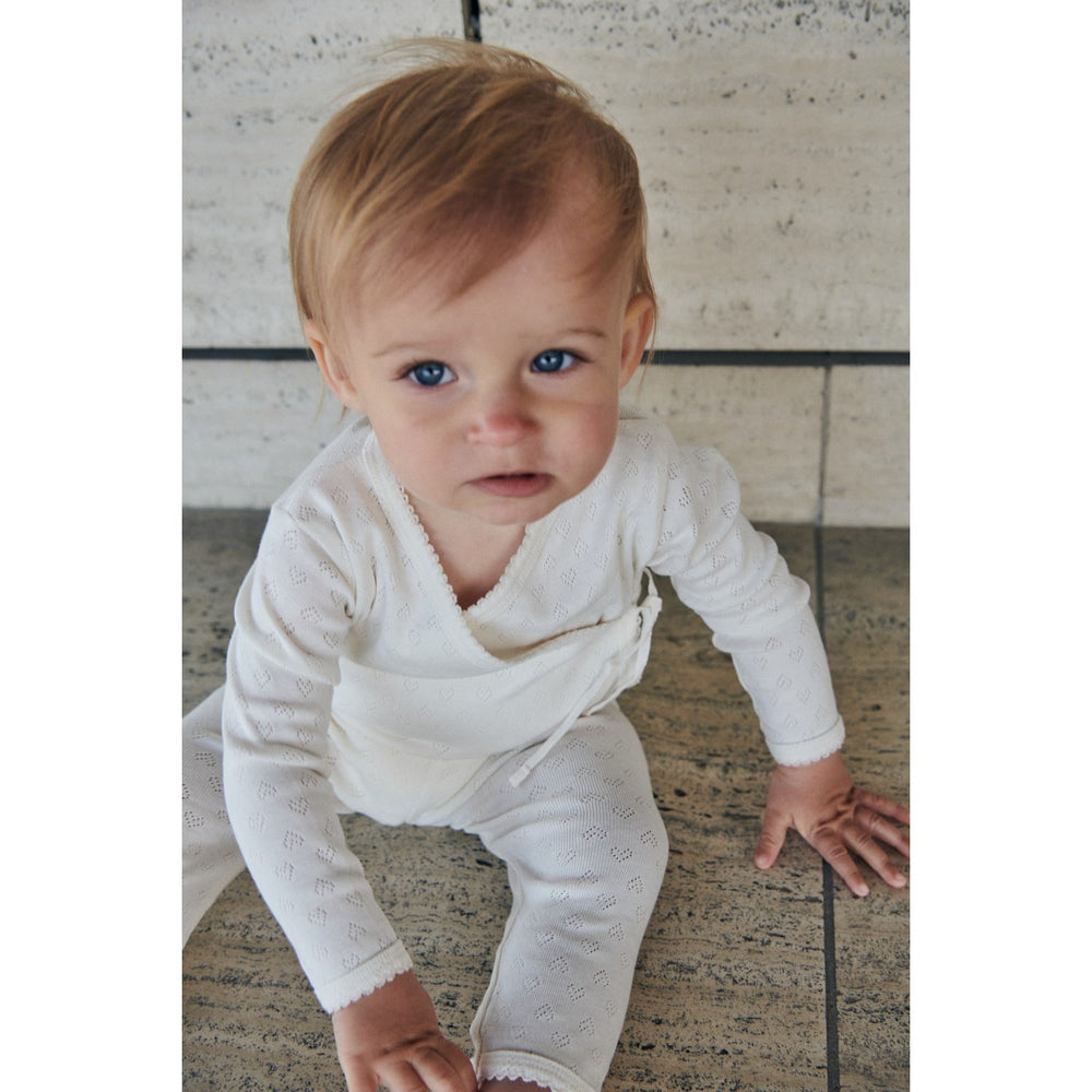 Køb COPENHAGEN COLORS Cream Pointelle Heart Crossover Body Ls