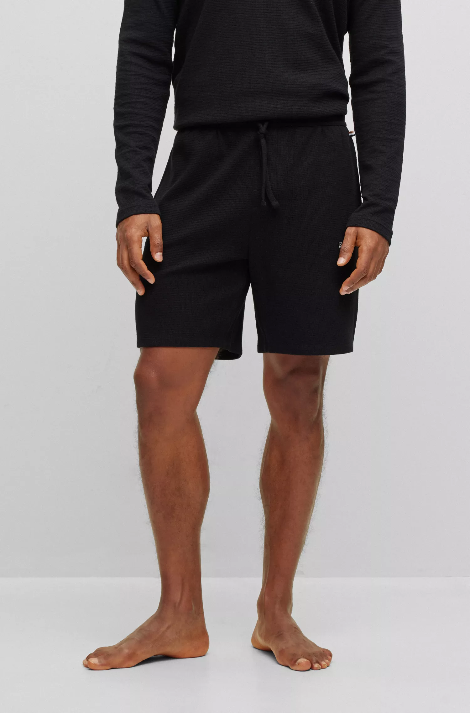 Calções de pijama BOSS em mistura de algodão preto com logotipo bordado.