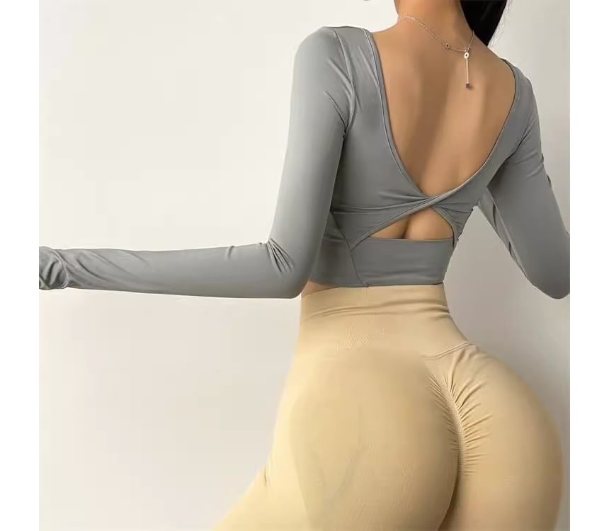 CUCURBIT - Sport T-shirt met lange mouwen en open rug