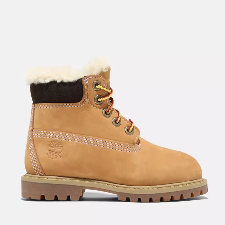 Bota de inverno Timberland Premium de 6 polegadas para crianças pequenas, na cor amarela.
