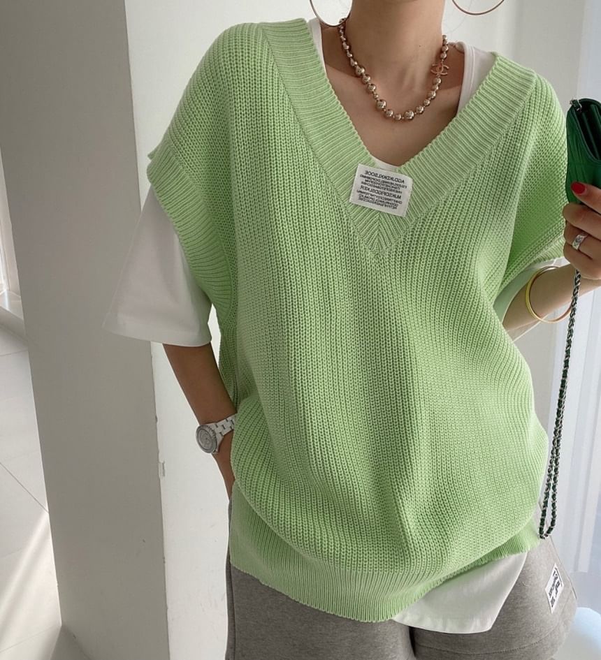 Coris - V-hals effen label applicatie gebreide trui vest