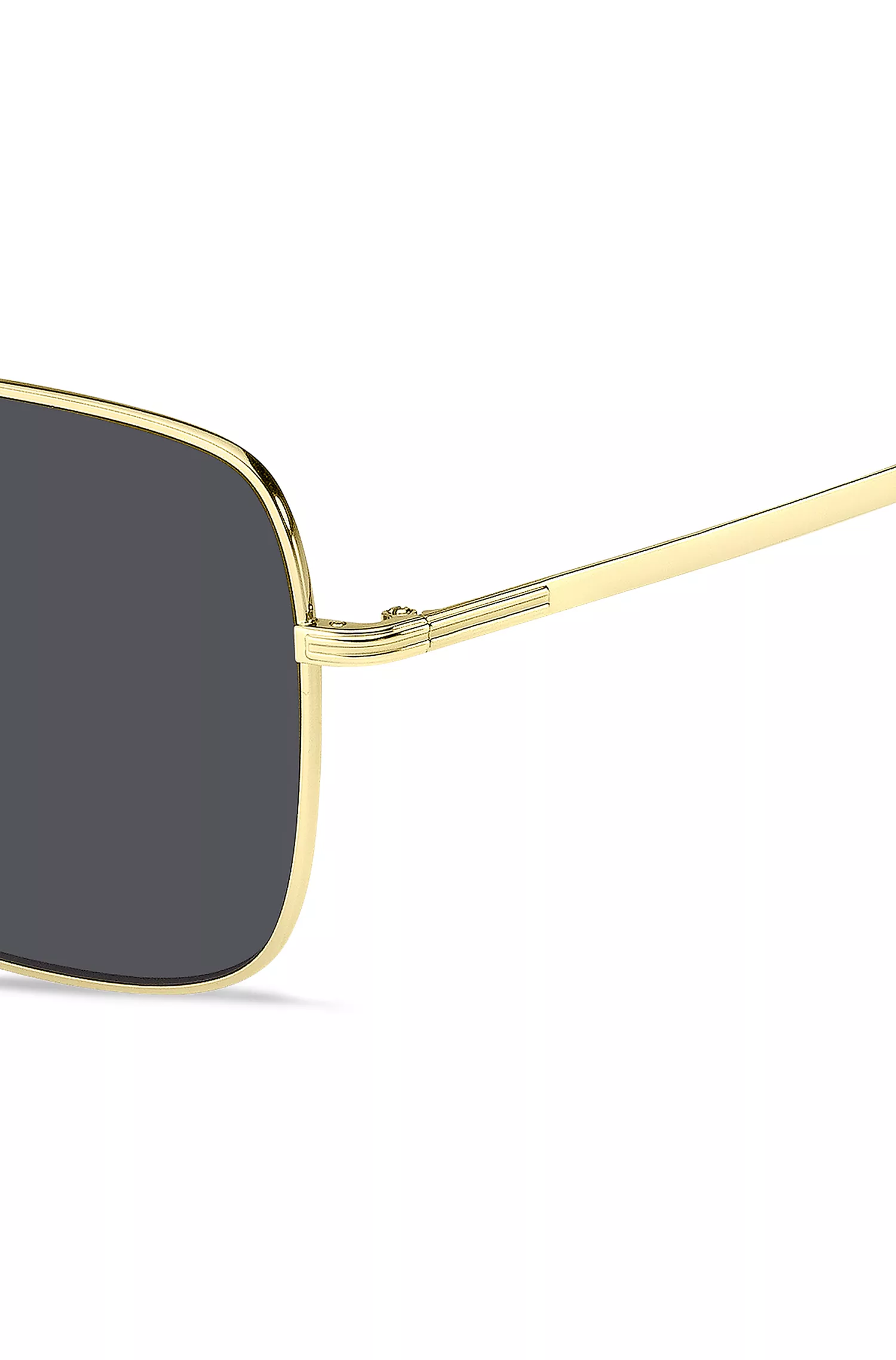 Óculos de sol BOSS em tons de preto e dourado com detalhes exclusivos.