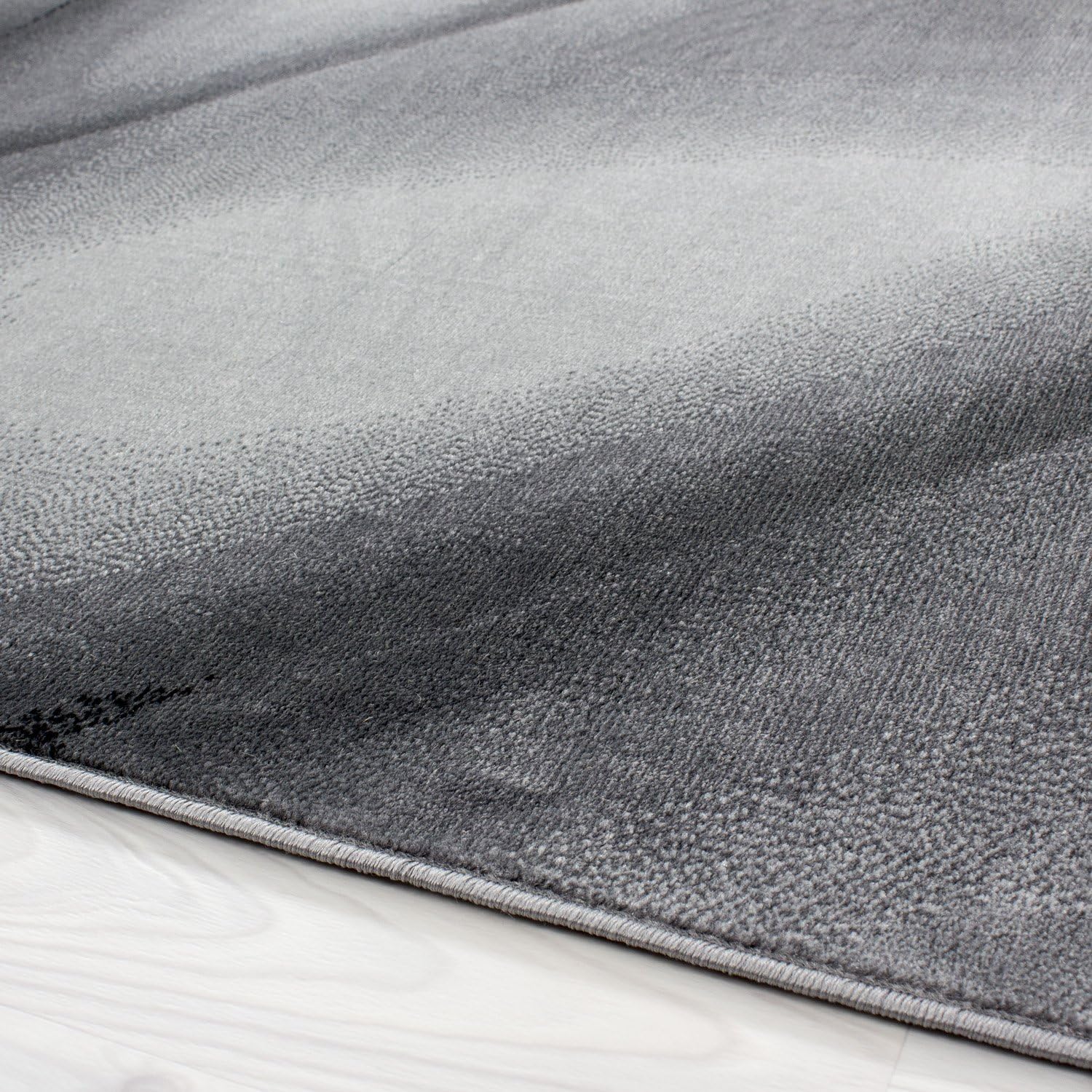 Carpetsale24 Kurzflor Teppich 240x340 cm, Modern Abstrakt Design in Schwarz Grau, Pflegeleicht, ideal für große Wohnräume, Loftbereiche oder Konferenzzimmer