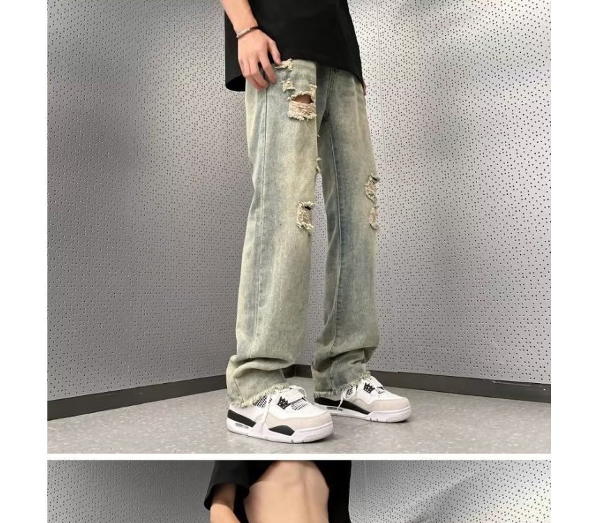 Femilina - High-waist distressed washed jeans met wijde pijpen