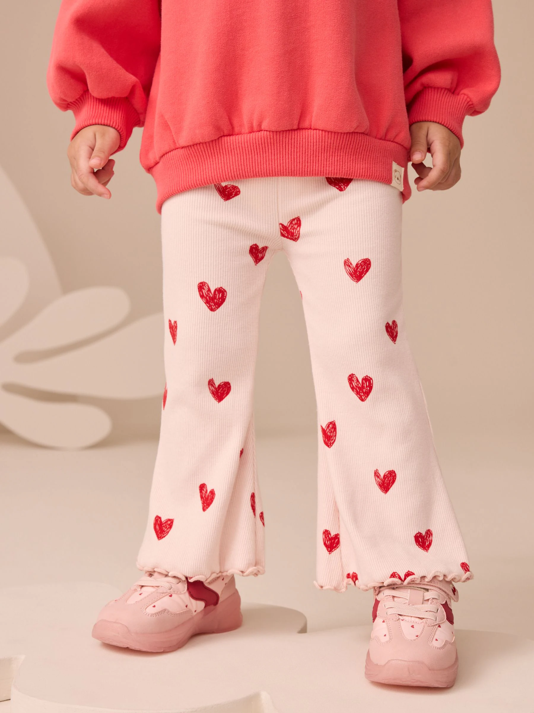 Lichtroze met hartje - Geribbelde flare legging (3 mnd-7 jr)