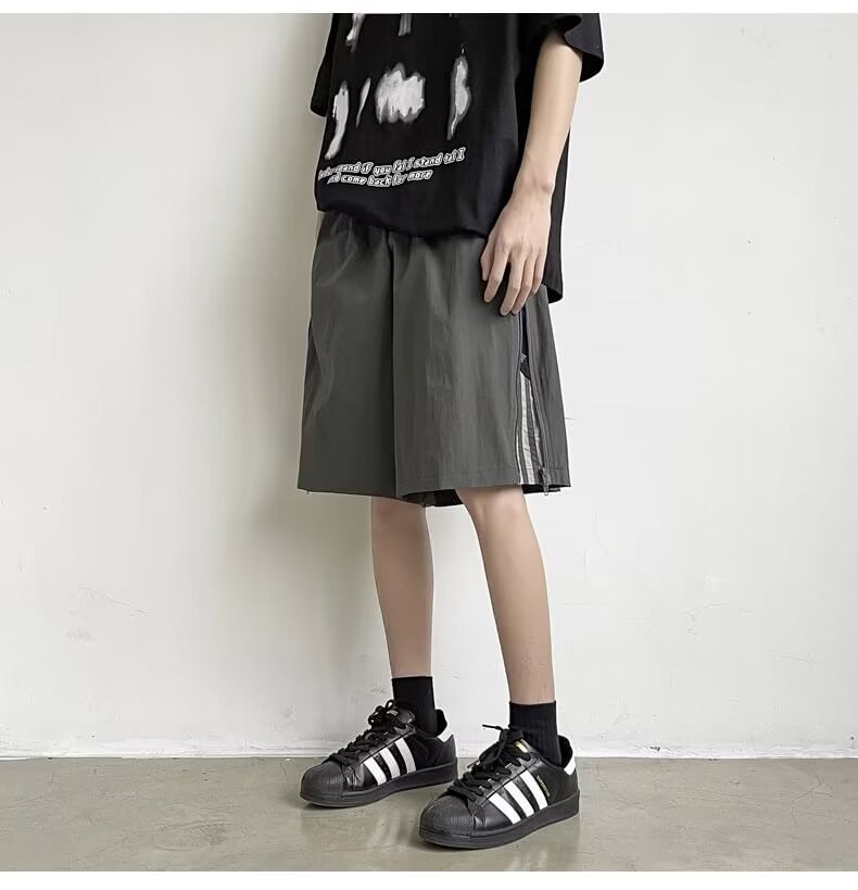 Urtishia - Shorts met hoge taille, rits aan de zijkanten en wijde pijpen