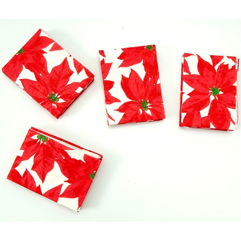 Serviettes poinsettia prépliées rouges